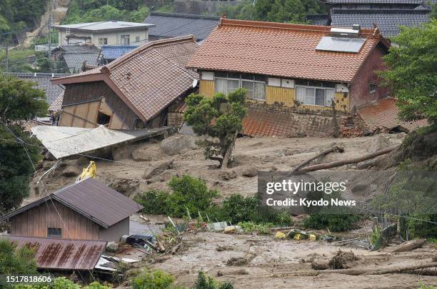 Photo taken on July 10 shows houses hit by a mudslide in Karatsu, Saga Prefecture, southwestern Japan, following heavy rain.