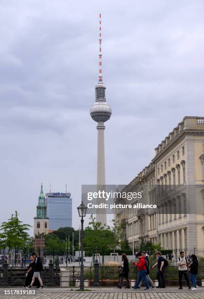 July 2023, Berlin: The Berlin TV Tower towers behind Berlin's Unter den Linden Palace. Built in 1969, the Berlin TV Tower is the tallest structure in...