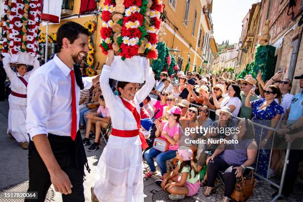 People attend the Festa dos Tabuleiros in Tomar, Portugal on July 9, 2023. The festival it's held every four years, is dedicated to the Holy Spirit...