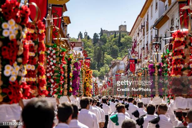 People attend the Festa dos Tabuleiros in Tomar, Portugal on July 9, 2023. The festival it's held every four years, is dedicated to the Holy Spirit...