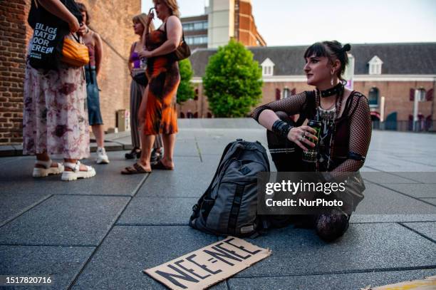 Woman is posing with a placard that says ''No=No'' in Dutch, during a protest against intimidation on the streets in Nijmegen, Netherlands, on July...