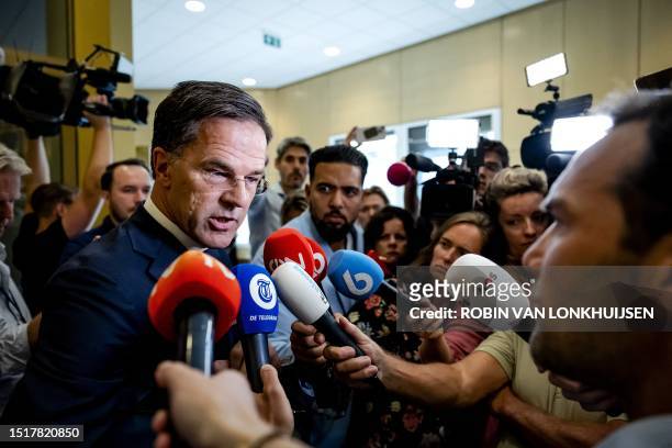 Outgoing Prime Minister Mark Rutte speaks to the press during a suspension after his statement on the fall of the cabinet at the House of...