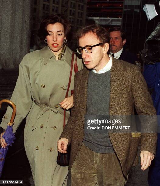 Picture taken 01 April 1993 of US movie director and actor Woody Allen arriving with an unidentified woman at the courthouse in New York. A judge...