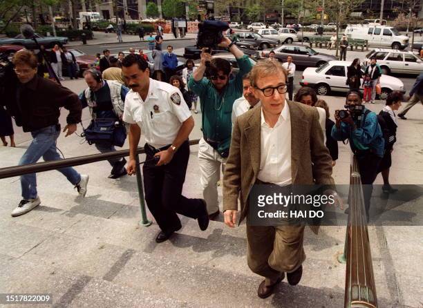 Picture taken 04 May 1993 of US movie director and actor Woody Allen making his way through the media to the courthouse in New York. A judge gave Mia...