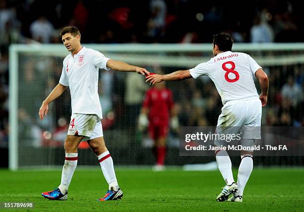 Steven Gerrard of England hands his captain's armband to Frank Lampard after being sent off during the FIFA 2014 World Cup qualifier group H match...