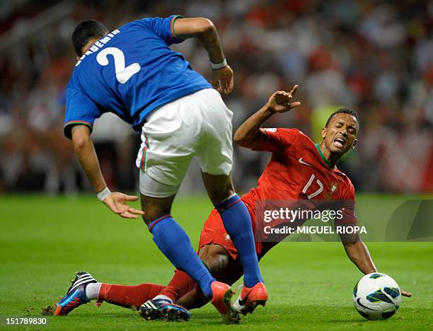 Azerbaijan's midfielder Ali Gokdemir vies for the ball with Portuguese midfielder Nani during the FIFA World Cup 2014 qualifying football match...