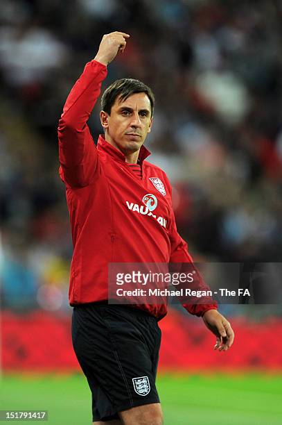 Gary Neville, assistant coach of England gives instructions during the FIFA 2014 World Cup qualifier group H match between England and Ukraine at...