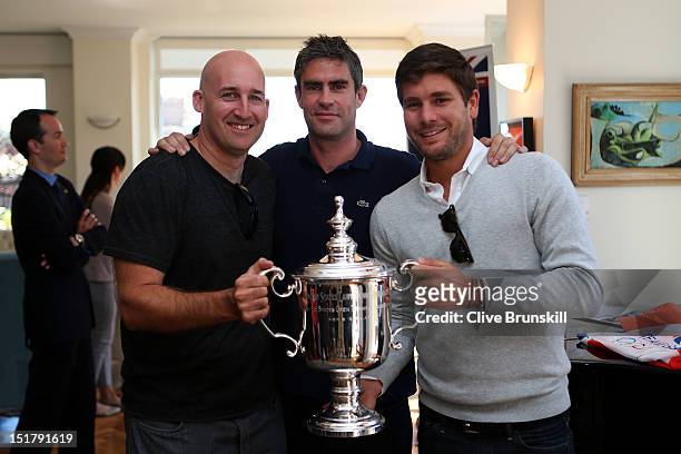 Jez Green, Andy Ireland and Daniel Vallverdu pose with the US Open Championship trophy at the British Consulate during Andy Murray of Great Britain's...