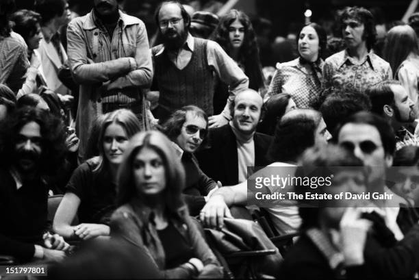 Singer songwriter Paul Simon and record producer and music industry executive Clive Davis attend a performance by Bob Dylan and The Band at Madison...