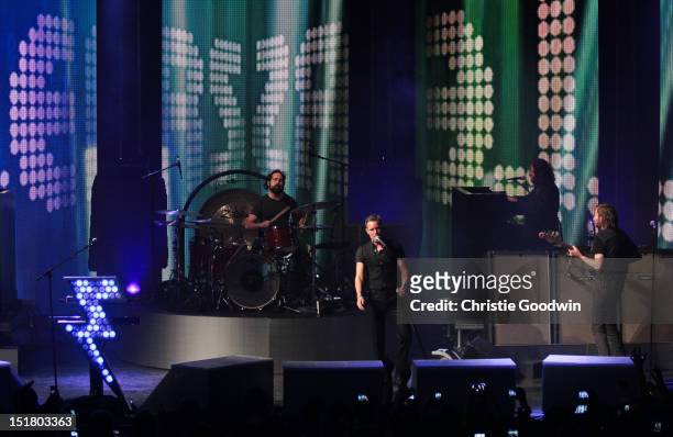 Ronnie Vannucci Jr., Brandon Flowers, Dave Keuning and Mark Stourmer of The Killers perform on stage during iTunes Festival at The Roundhouse on...