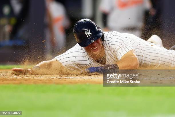 Anthony Volpe of the New York Yankees scores on Kyle Higashioka RBI single in the fifth inning against the Baltimore Orioles at Yankee Stadium on...