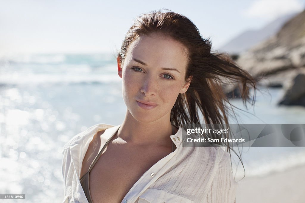 Portrait of smiling woman on sunny beach