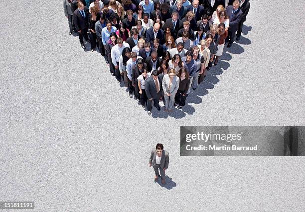 businesswoman at apex of crowd - leadership bildbanksfoton och bilder