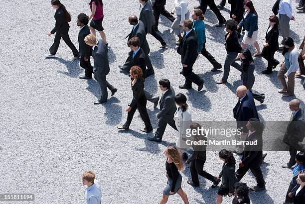 business people walking - crowd of people walking stock pictures, royalty-free photos & images