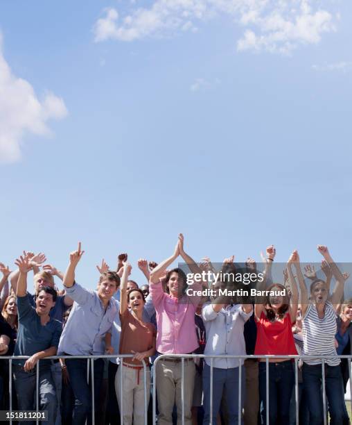 cheering crowd with arms raised - front row photos stock pictures, royalty-free photos & images