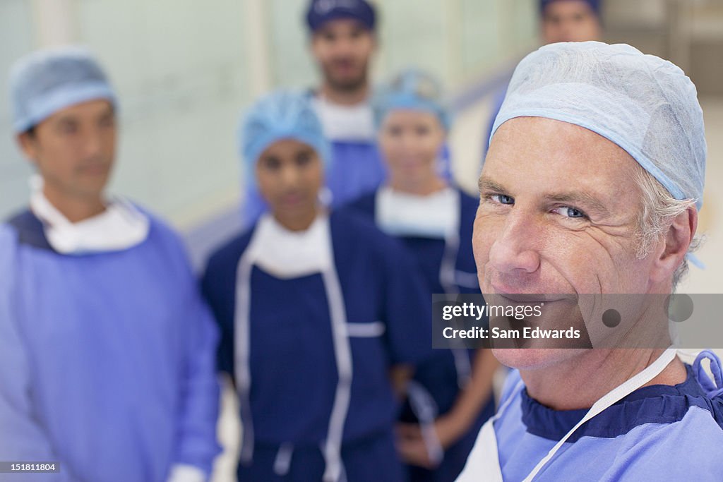 Portrait of smiling surgeons and nurses in hospital