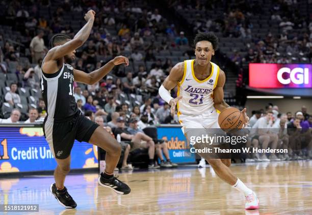 Maxwell Lewis of the Los Angeles Lakers drives toward the basket against Blake Wesley of the San Antonio Spurs in the first half during the 2023 NBA...