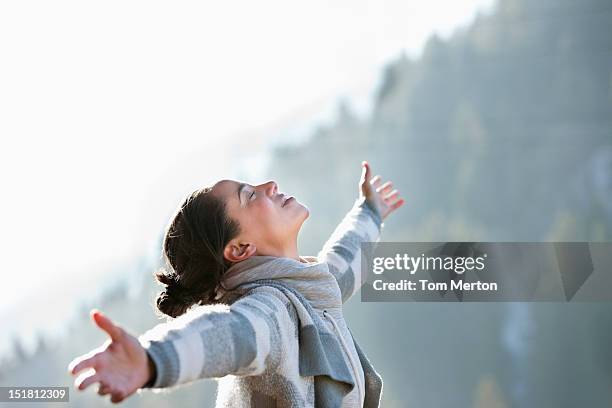 woman with head back and arms outstretched - fitness vitality stockfoto's en -beelden