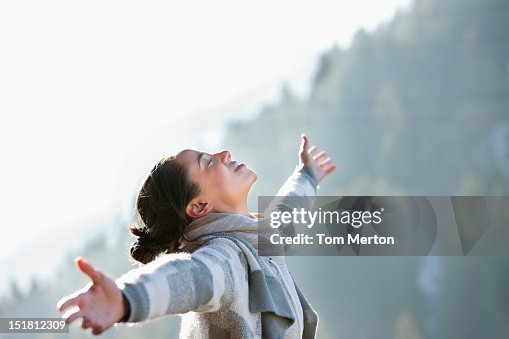 Woman with head back and arms outstretched Woman with head back and arms outstretched
