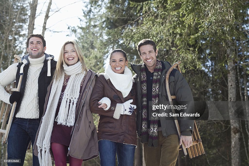 Smiling couples walking in woods