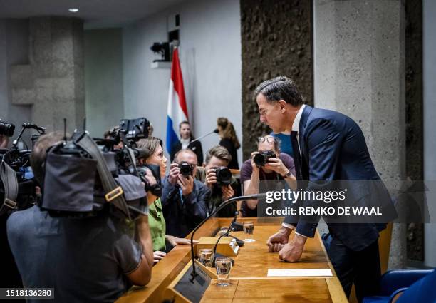 Outgoing Dutch Prime Minister, Mark Rutte speaks with member of the House of Representatives and member of the Christian Union, Mirjam Bikker during...