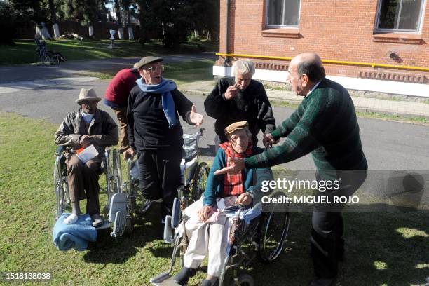 Alfredo Maciel sings with a group of fellow elderly men, just hours before getting married to Nilsa Noble at the public geriatric hospital Piñeyro...