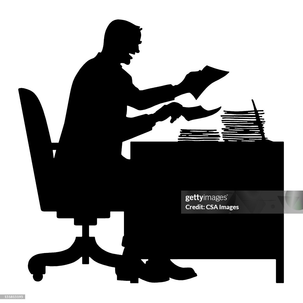 Silhouette of Man At Desk