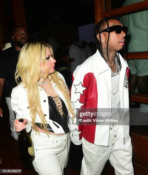Avril Lavigne and Tyga attend Red White & Bootsy at Nobu Malibu on July 04, 2023 in Malibu, California.