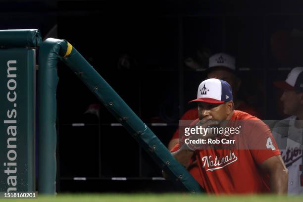 Manager Dave Martinez of the Washington Nationals looks on from the dugout during the ninth inning of the Nationals 9-2 loss to the Cincinnati Reds...