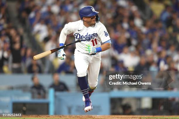 Miguel Rojas of the Los Angeles Dodgers runs out an RBI single against the Pittsburgh Pirates in the fourth inning at Dodger Stadium on July 05, 2023...