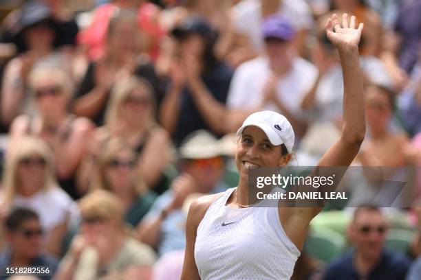 Player Madison Keys celebrates beating Russia's Mirra Andreeva during their women's singles tennis match on the eighth day of the 2023 Wimbledon...