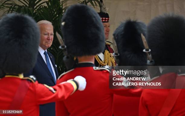 President Joe Biden and Britain's King Charles III watch a military march past by members of the Welsh Guards, during a ceremonial welcome in the...