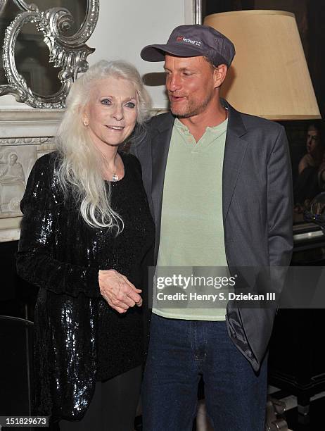 Singer Judy Collins and actor Woody Harrelson pose for photos at the Cafe Carlyle on September 11, 2012 in New York City.