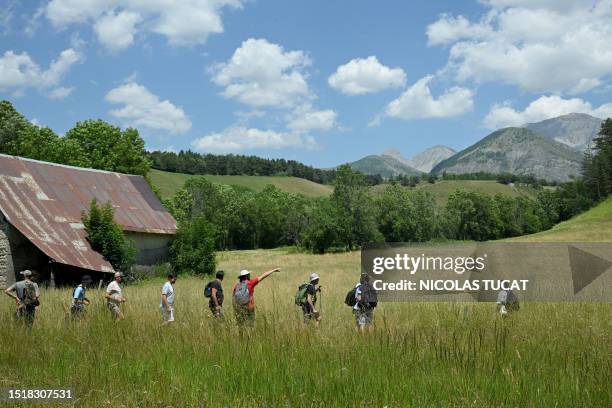 Volunteers take part in a search operation for two-and-a-half-year-old Emile who is reported missing for two days, on July 10, 2023 in the French...