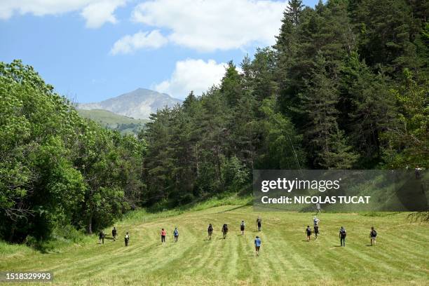 Volunteers take part in a search operation for two-and-a-half-year-old Emile who is reported missing for two days, on July 10, 2023 in the French...