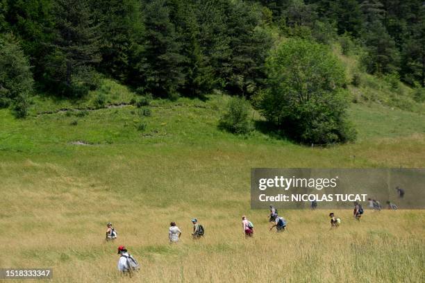 Volunteers take part in a search operation for two-and-a-half-year-old Emile who is reported missing for two days, on July 10, 2023 in the French...