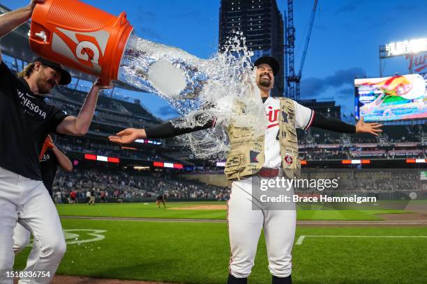 Pablo Lopez of the Minnesota Twins is doused with water by Bailey Ober following a complete game shutout against the Kansas City Royals on July 5,...