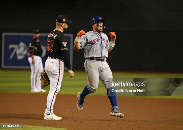 Francisco Alvarez of the New York Mets reacts after hitting a solo home run against the Arizona Diamondbacks during the ninth inning at Chase Field...