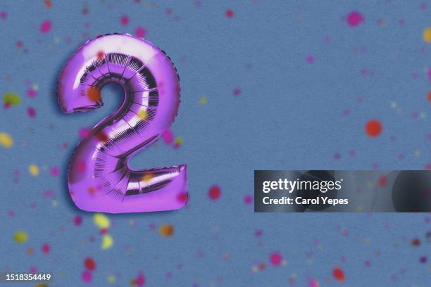 number two in purple  foil balloon - second stock pictures, royalty-free photos & images