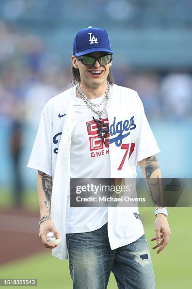 Peluma Rapper Rapper Peso Pluma reacts before throwing the first pitch prior to a ...
