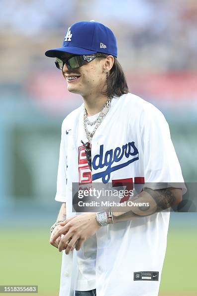 Peluma Rapper Rapper Peso Pluma reacts before throwing the first pitch prior to a ...