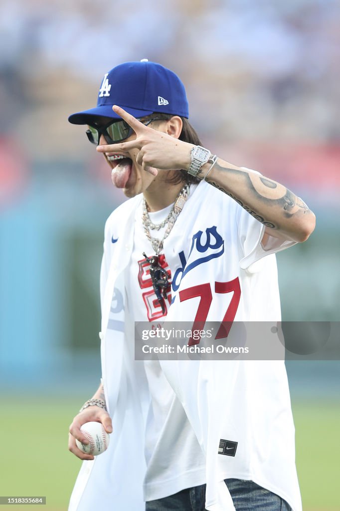 Peluma Rapper Rapper Peso Pluma reacts before throwing the first pitch prior to a ...