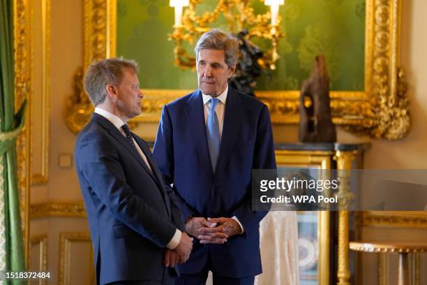 Secretary of State for Energy Security and Net Zero Grant Shapps and United States Special Presidential Envoy for Climate John Kerry wait to meet...