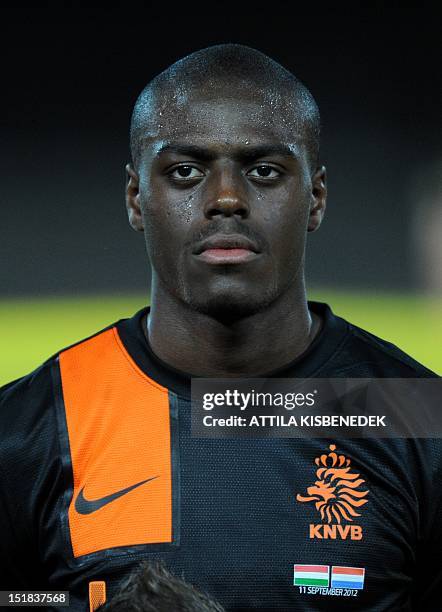 Netherland's Bruno Martins Indi listens to a national anthem on September 11, 2012 at Puskas stadium in Budapest before a World Cup 2014 qualifying...