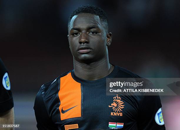 Netherland's Jetro Willems listens to the national anthem on September 11, 2012 at Puskas stadium in Budapest before a World Cup 2014 qualifying...