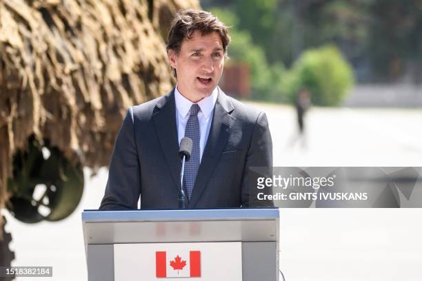 Canada's Prime Minister Justin Trudeau addresses a joint press conference with the Latvian Prime Minister at the Adazi military base in Riga, Latvia,...