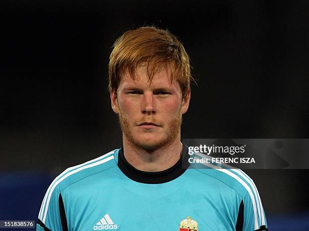 Hungary's Adam Bogdan listens to a national anthem on September 11, 2012 at Puskas stadium in Budapest before a World Cup 2014 qualifying football...