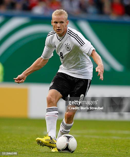 Sebastian Rode of Germany runs with the ball during the Under 21-Euro qualifier match between Germany U21 and Belarus U21 at DKB Arena on September...