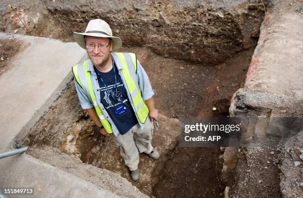 Archaeologist Mathew Morris of the University of Leicester poses for pictures in central England, on September 12 at a site where a skeleton that...
