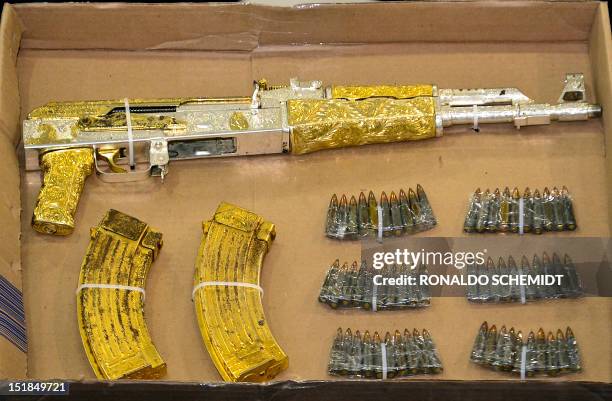 Gold-plated AK-47 rifle seized to alleged leader of "The Resistance" drugs cartel, Ramiro Pozos Gonzalez, aka "El Molca", is presented to the press...